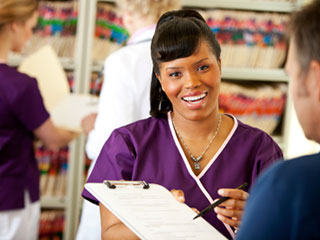 Optometrist explaining insurance information to patient