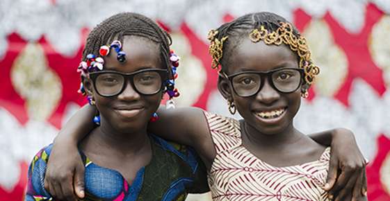 two kids wearing glasses 