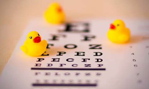 Rubber ducks on eye exam letters