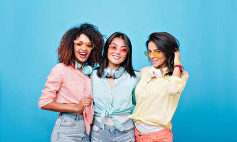 Three women wearing sunglasses