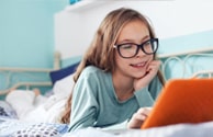 Child Using Blue Light Glasses At Computer Screen