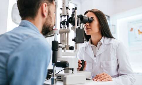 Man Receiving Eye Exam From Vision Pro Optical Optomistrist In Minnesota