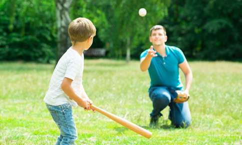 Father and son playing baseball