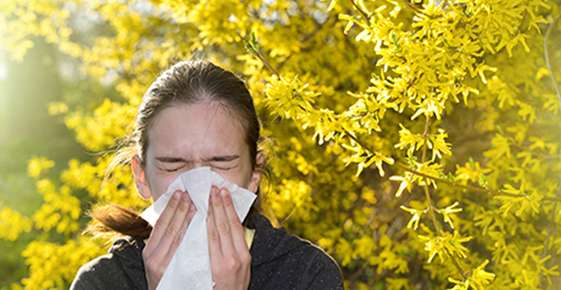 woman blowing her nose 