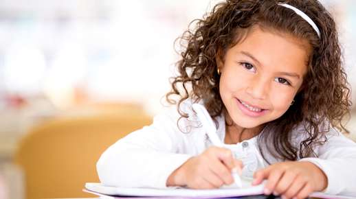 Little girl writing 