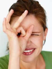 Woman making circle around eye