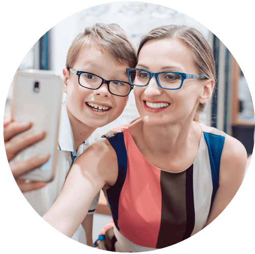 woman and son trying on glasses best for cool skin tones