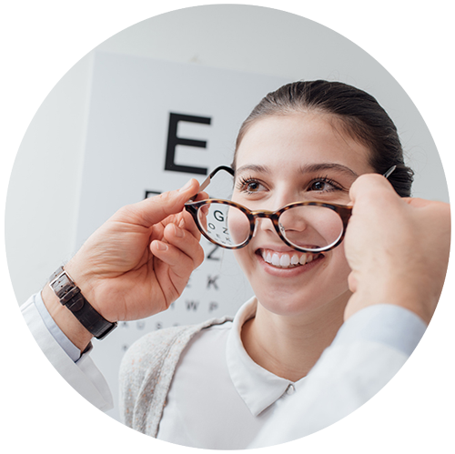 woman trying on glasses it fit a warm skin tone